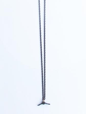 Oxidized tiny caudal vertebrae on a 14k jump-ring on 18