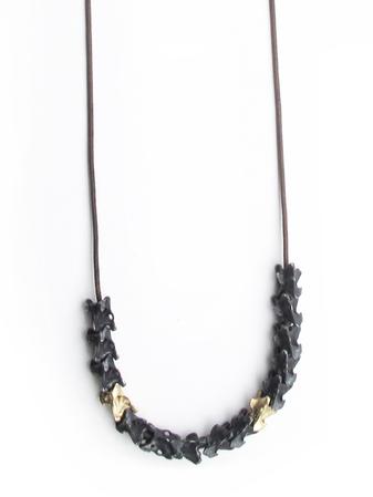 Thirteen oxidized & two 14k vertebrae